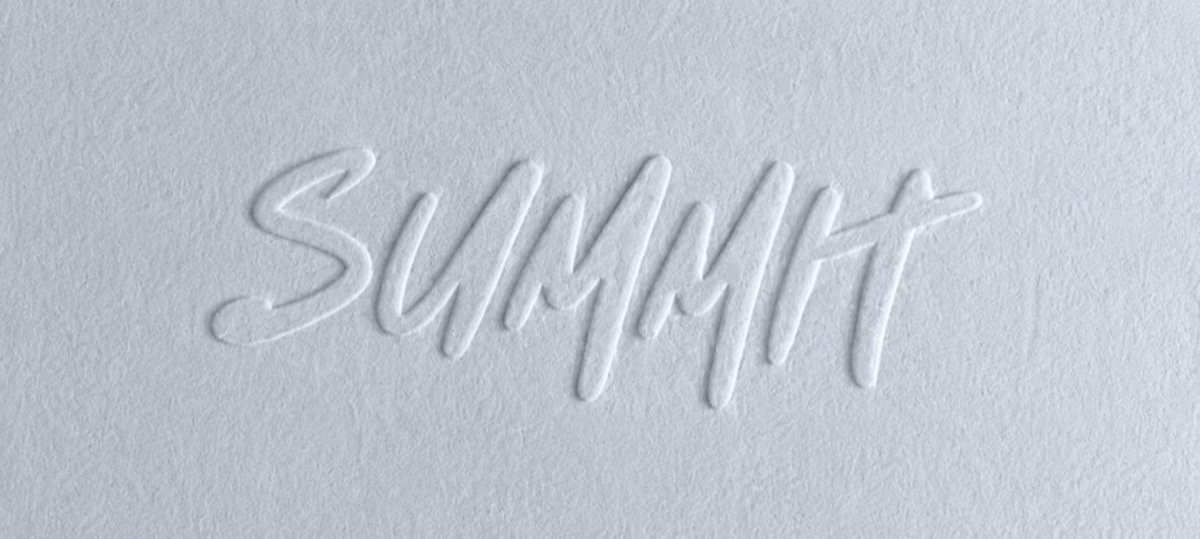 Raised Summit lettering embossed into white textured material